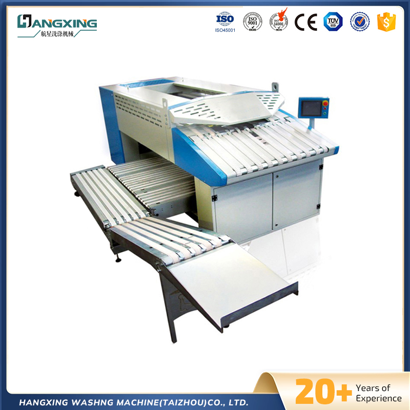 Skládací stroj na ručníky Skládací stroj na ručníky